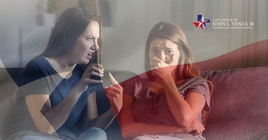 women sitting on couch