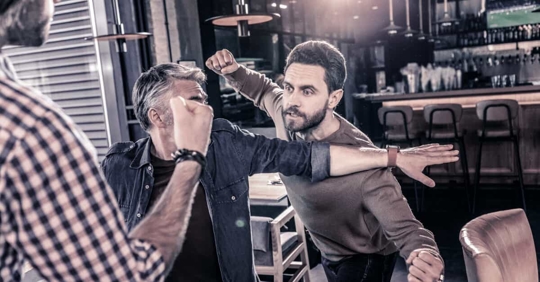 men fighting in a bar fists flying
