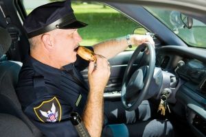 Officer Eating a Donut